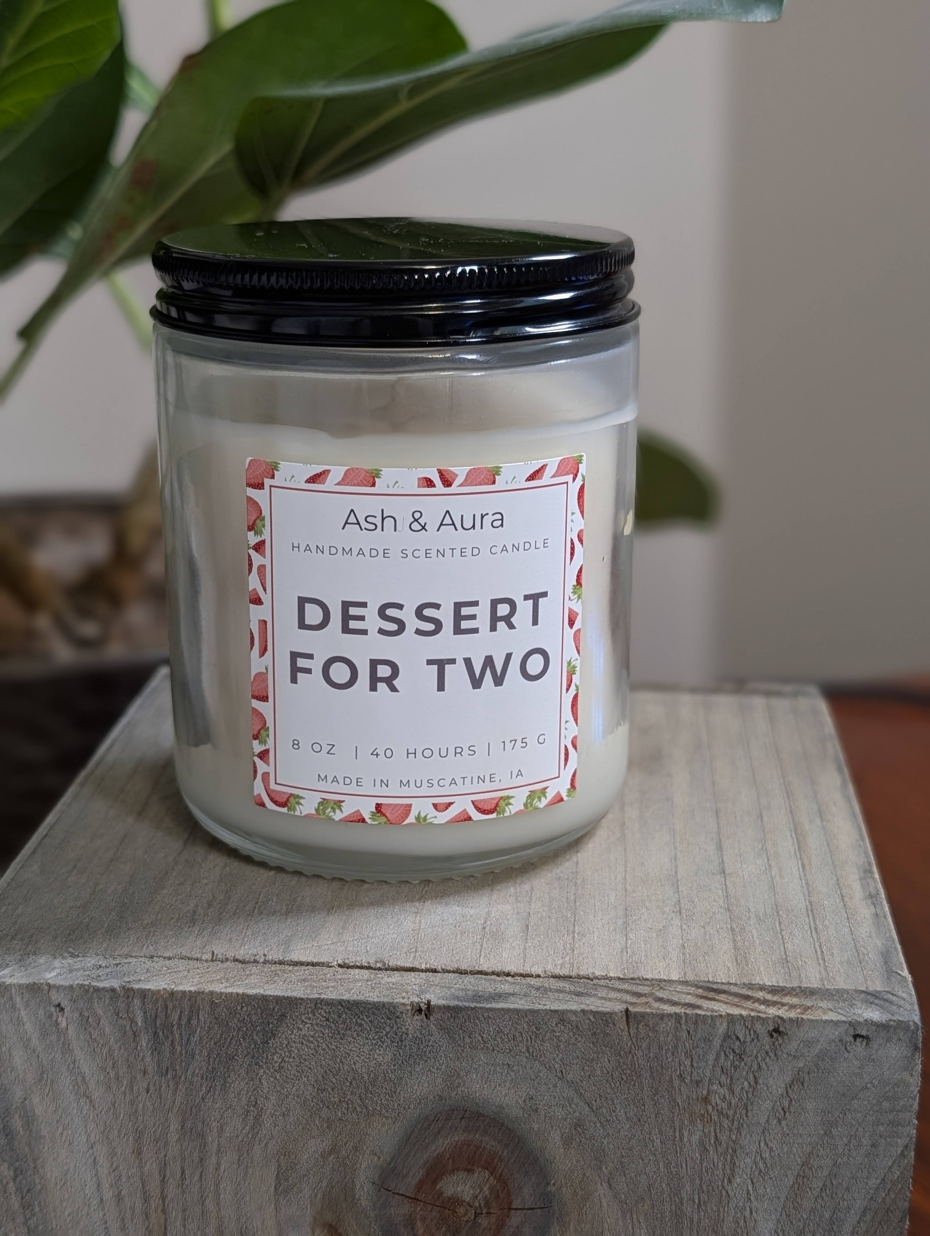 Dessert for Two soy blend candle in a [clear glass jar] with a white Ash & Aura label.