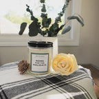 A close-up of the unlit Home for the Holidays candle.