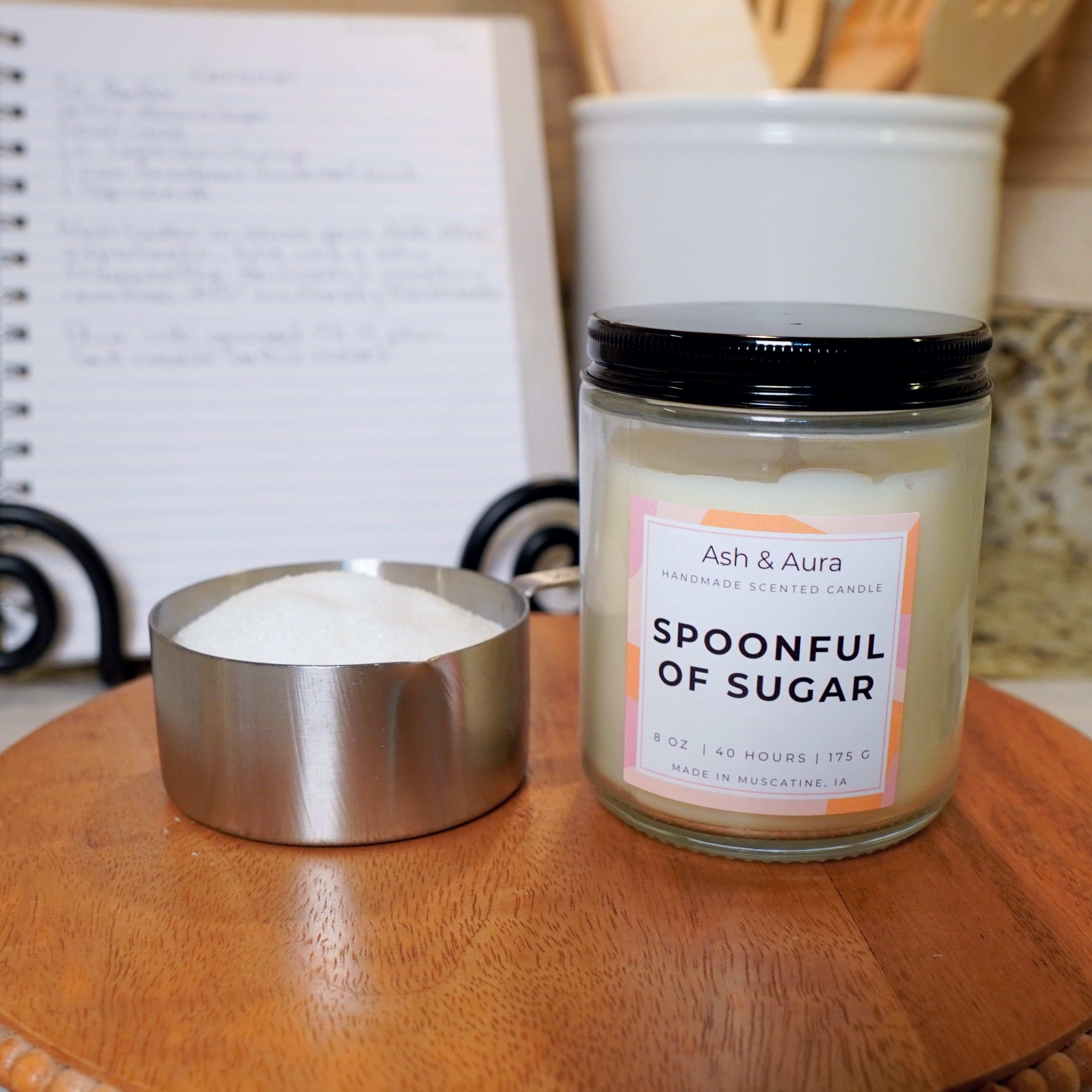 Spoonful of Sugar soy blend candle in a [clear glass jar] with a white Ash & Aura label.